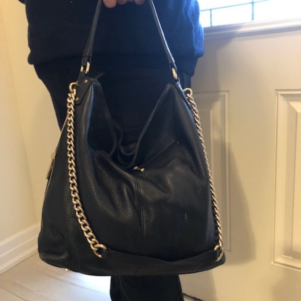 Danier black whole genuine leather ,with gold chain with dust bag ,like new